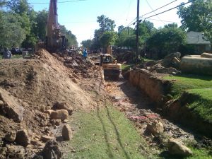 Backhoe digging trench